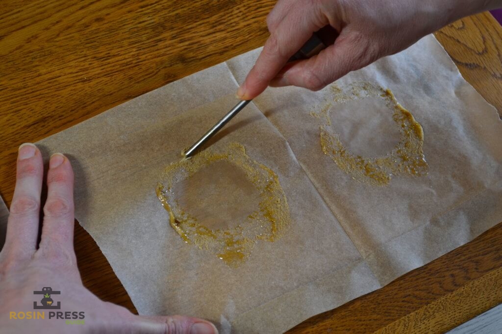 Collecting rosin using dab tool on parchment paper