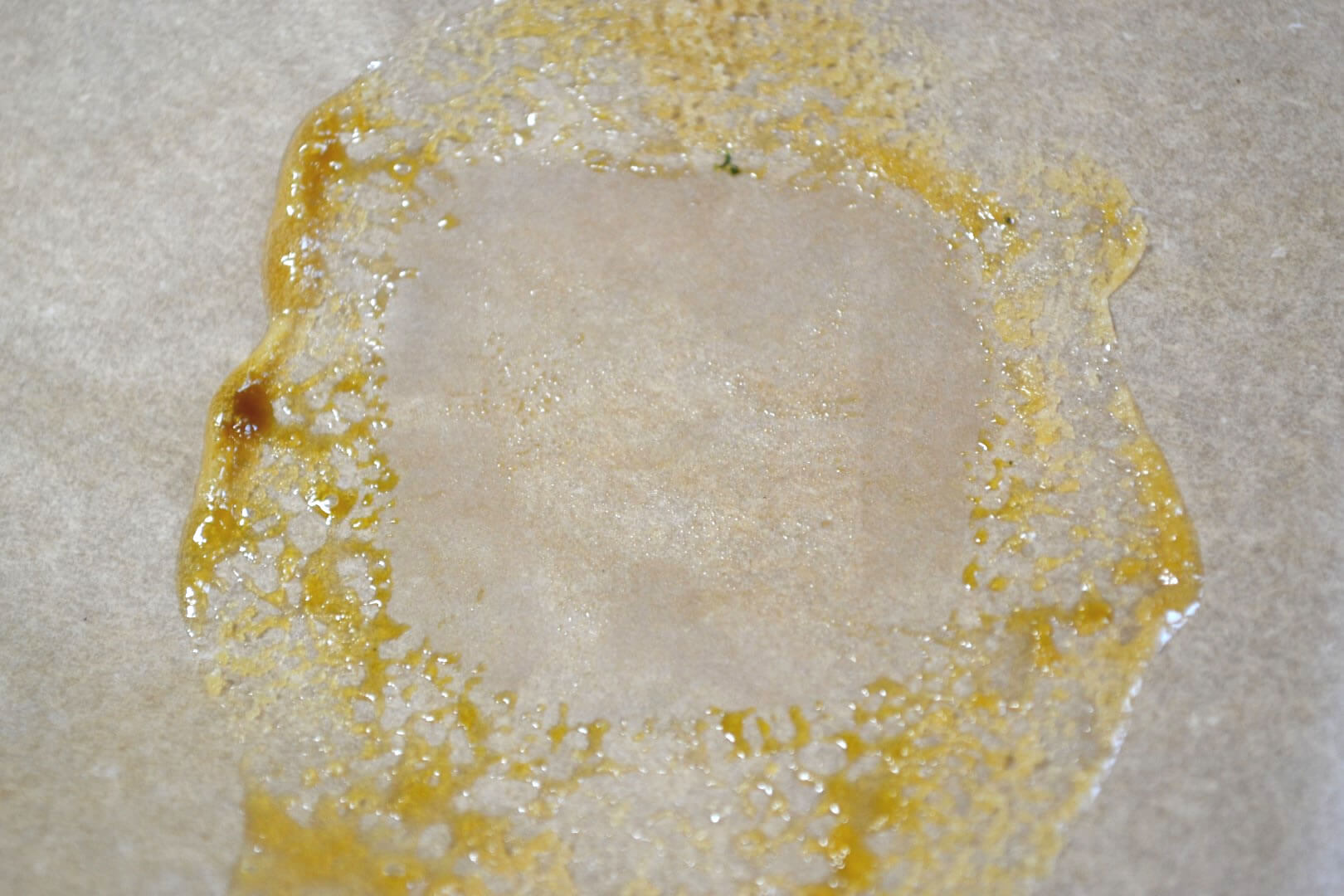 Flower rosin. Pressed through a 25 micron rosin bag. Absolutely LOVE this  color. 😍 Yup, smells good too. Actually very much like cucumber melon., By Crow Told Farm